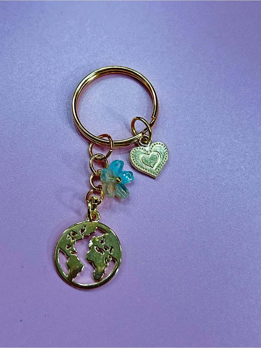 Gold Tone World Map Keyring with Heart & Aqua Flower Charm